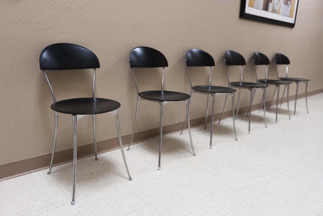 Six (6) Enzo Mari Tonietta Chairs: Six (6) Enzo Mari “Tonietta” Chairs, cast aluminum, black leather. Height: 33 inches approximately.