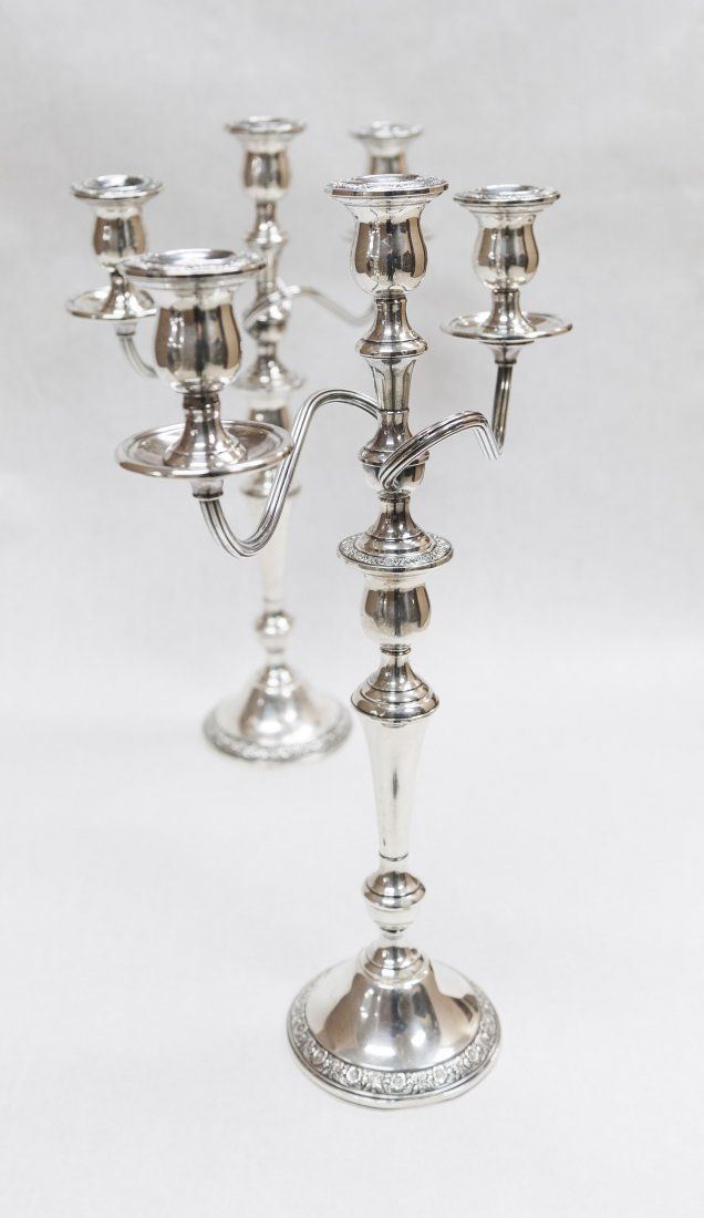 Pair of Sterling Silver Candelabra. (weighted).: Pair of International sterling silver candelabra, weighted. Detachable 3-light branch to form a shorter candelabra or single candle holders. (Approx. 17" tall, 13 1/2" wide).