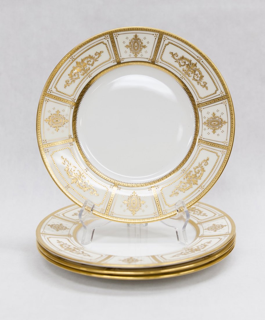 (4) Minton Bone China H3030 Plates.: Set of (4) Minton bone china place plates, Tiffany & Co New York. H3030. White porcelain with gilt encrusted arabesques in reserve decoration. (Approx. 10 5/8" diameter).