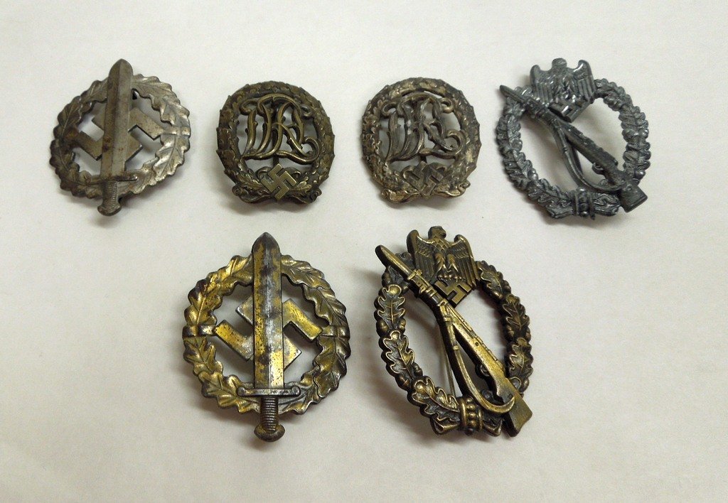 Group of six (6) German WWII military Badges: Group of six (6)German WWII military Badges. Includes two Infantry Combat Badges, (more commonly referred to as the Infantry Assault Badge), one silver (infantry) marked on back JB&Co., and one bronze
