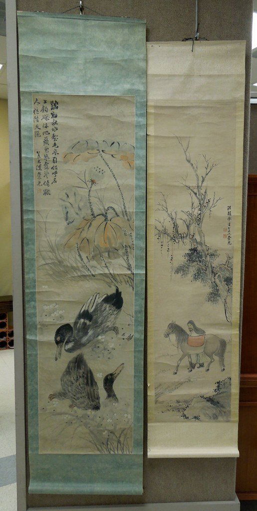 (2) Asian Hand Colored Scrolls.: (2) Asian hand colored scrolls. Landscapes with ducks in water, man with horse. (Approx. 59" x 16" & 53" x 13 1/4").