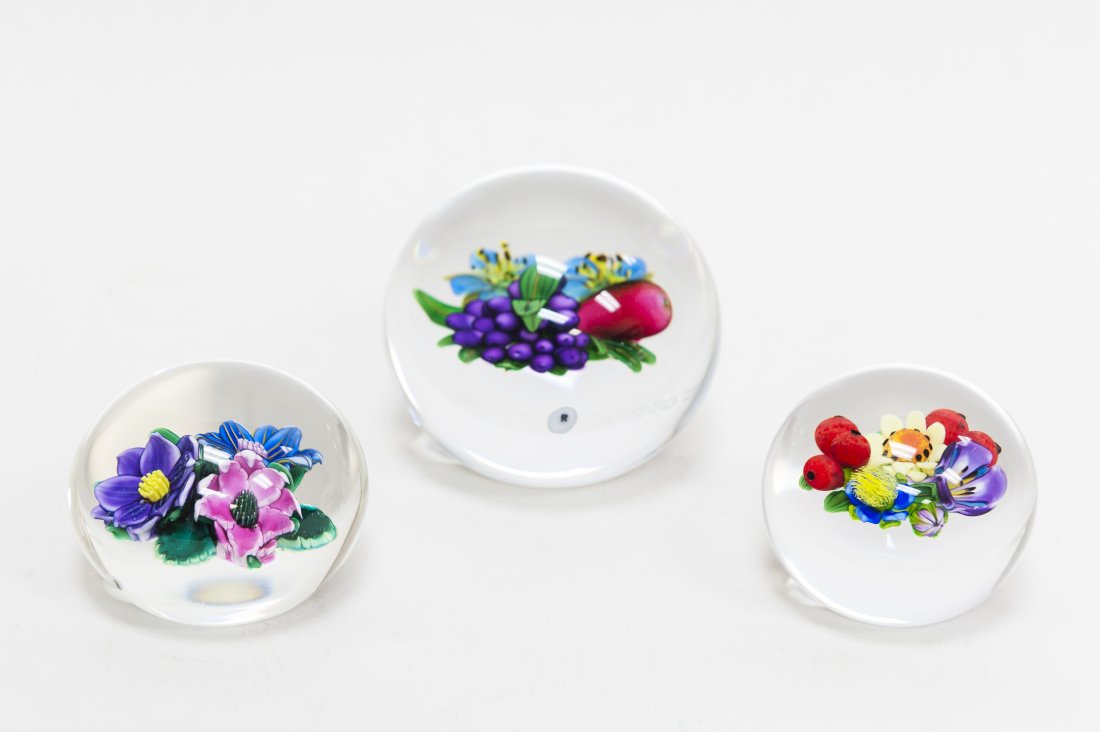 (3) Ken Rosenfeld Art Glass Paperweights.: (3) Ken Rosenfeld Art glass paperweights. Clustered flower motifs. One signed Ken Rosenfeld 2000 (approx. 2 3/4" x 3 1/4"), two signed Ken Rosenfeld '84 and K.R. 2000 (approx. 2" x 2 3/8"). From the C
