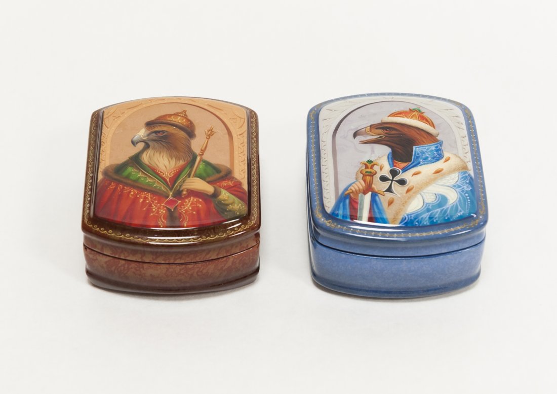 Pair of Russian Lacquer Snuff Boxes.: Pair of Russian lacquer snuff boxes. Casket form with hinged lids, each hand painted with portraits of a regally cloaked eagle. Marbleized brown and blue grounds. Circa 2000. (Approx. 1 1/4" x 2 3/4" 