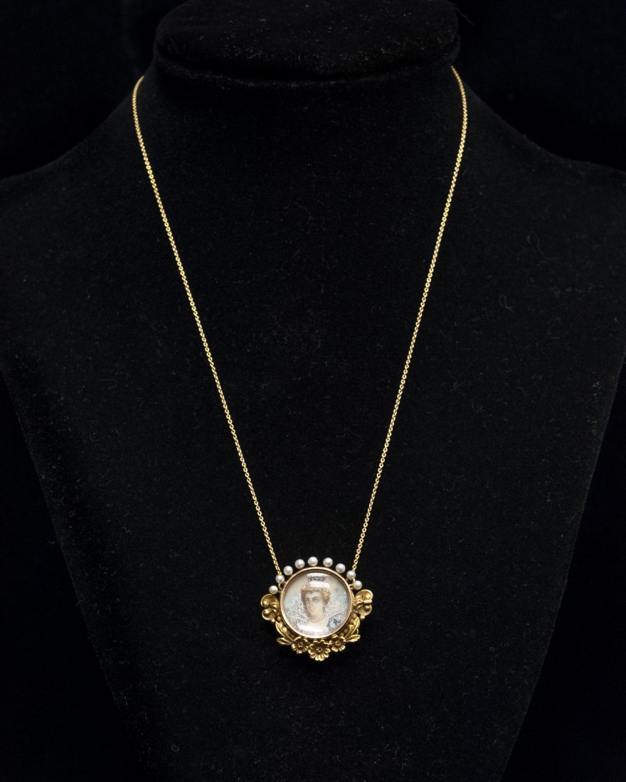 Vintage Gold and Seed Pearl Portrait Pendant.: Vintage yellow gold circular pendant with seed pearl corona crest and floral chased pediment. Framing a miniature hand painted portrait of a queen, suspended on an integral fine link chain. Touch test