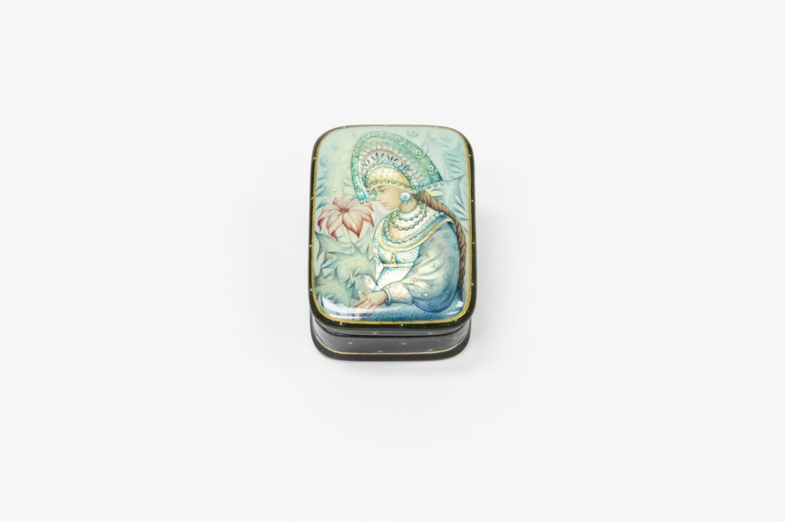 Aldoshkina Russian Fedoskino Lacquer Box.: Russian Fedoskino miniature rectangular lacquer box. Miniature painting on lid depicts girl in light blue costume with iridescent accents and a flower. Signed Aldoshkina. ( Approx. 3/4" x 2" x 1 1/2")