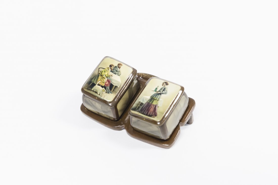 (2) Russian Fedoskino Lacquer Boxes on Stand.: (2) Miniature Russian Fedoskino lacquer boxes on stand, ‘The Teahouse Soldier’. One box depicts two soldiers seated at a table with a white cat at their feet, the other, a bar maiden carrying a bo