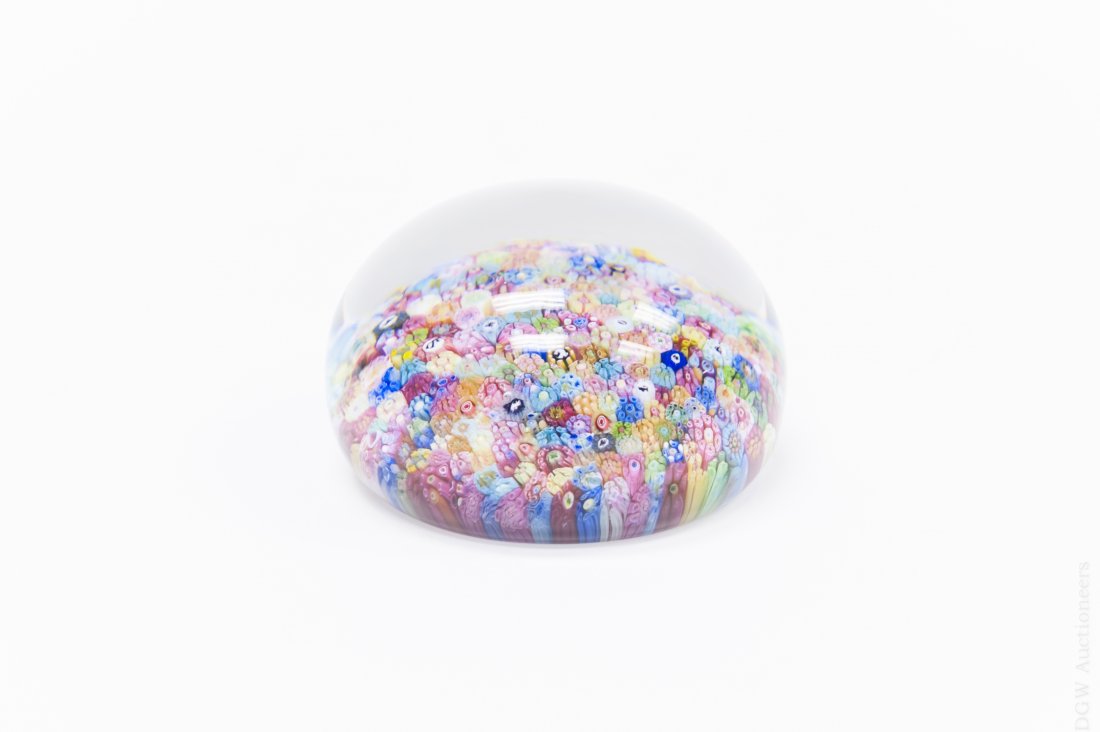 Baccarat Zodiac Art Glass Paperweight.: Baccarat close pack multicolor millefiori paperweight with Zodiac silhouettes. Dated 1969. (Approx. 2 1/2" x 3"). From the Collection of Eric Sinizer.