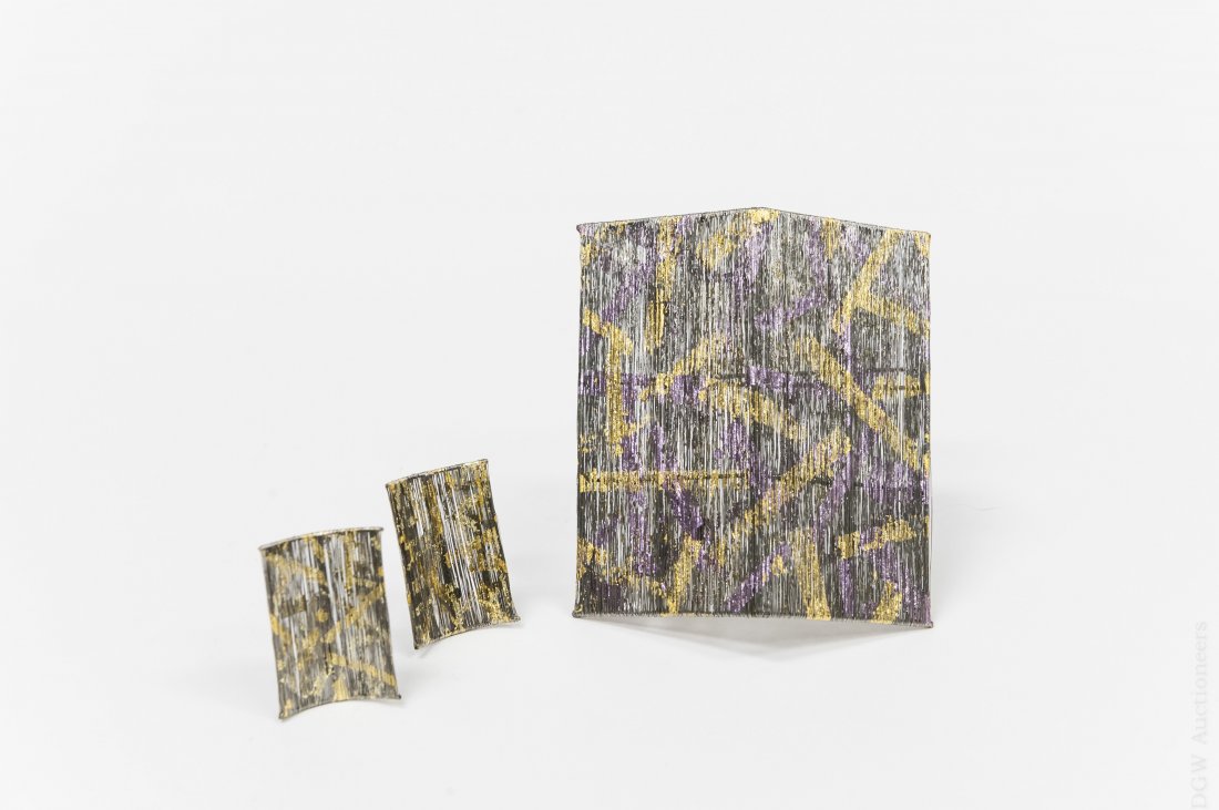 Emiko Suo Brooch and Earring Set.: Emiko Suo screwback earrings and brooch set. Made up of fine stainless steel wire with fragments of gold and silver leaf.