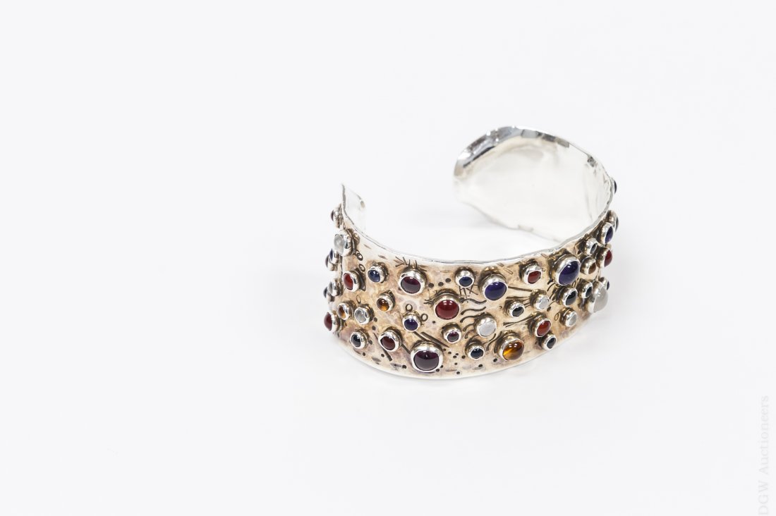Soren Pedersen, Sterling Silver and Stone Cuff.: Soren Pedersen sterling silver cuff with garnet, onyx, amethyst, amber, tourmaline, moonstone, chalcedony, and carnelian stones. Etched signature and marked sterling. (Approx. 16cm x 2.5cm).