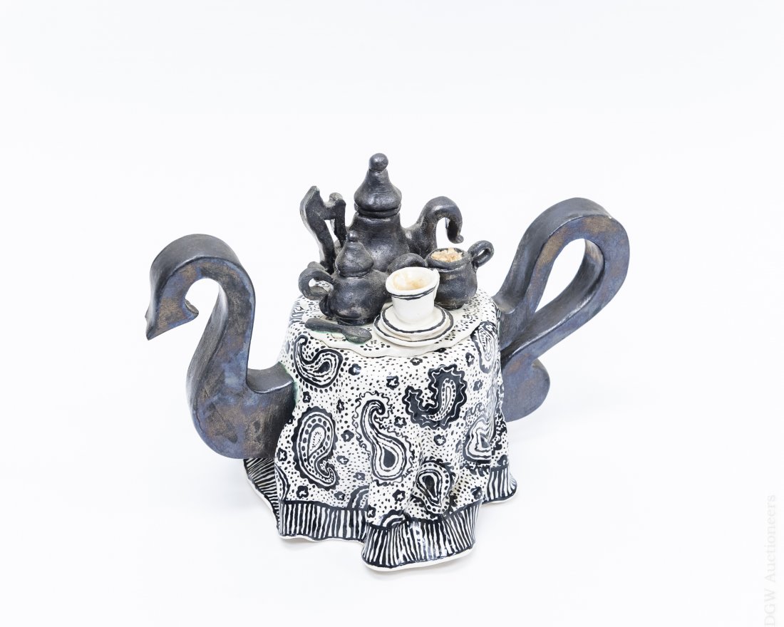 Leslie Roth Ceramic Teapot.: Leslie Roth Ceramic teapot in the form of a table setting with tea service finial. (Approx. 7 3/4" x 11").