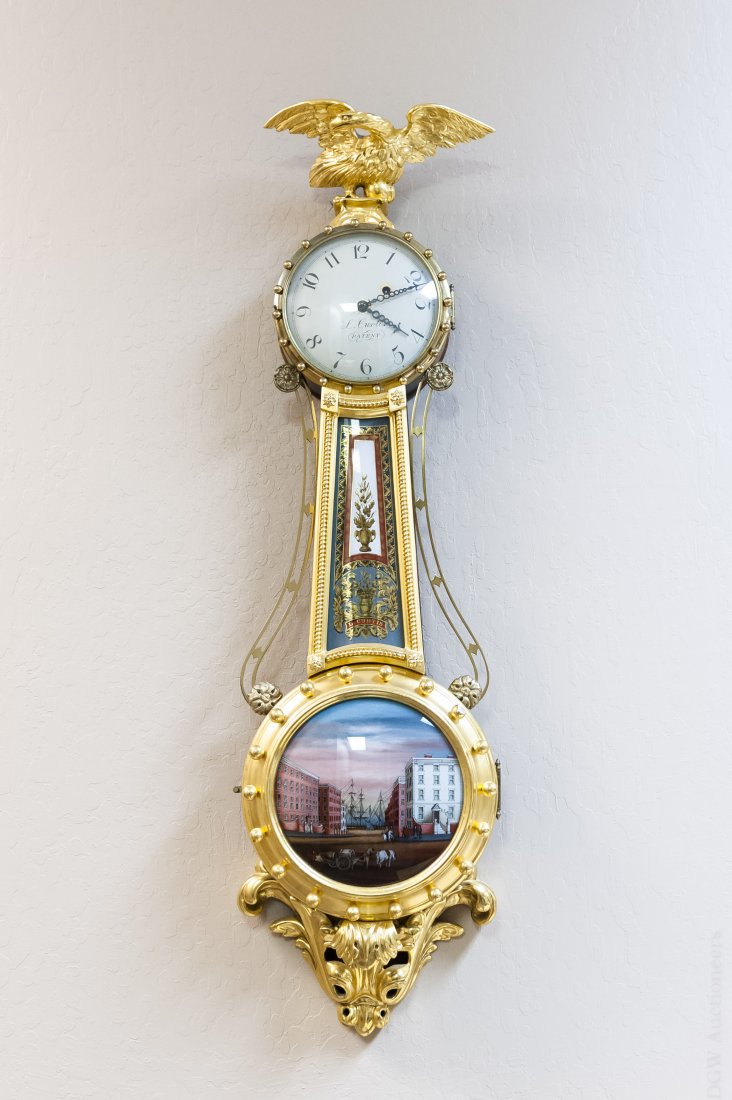 Lemuel Curtis Girandole Banjo Wall Clock.: Girandole Banjo wall clock. Face with Arabic hour numbers, signed L. Curtis’s Patent. Convex reverse painted lower glass depicts a harbor scene. Reverse painted throat glass including painted name L