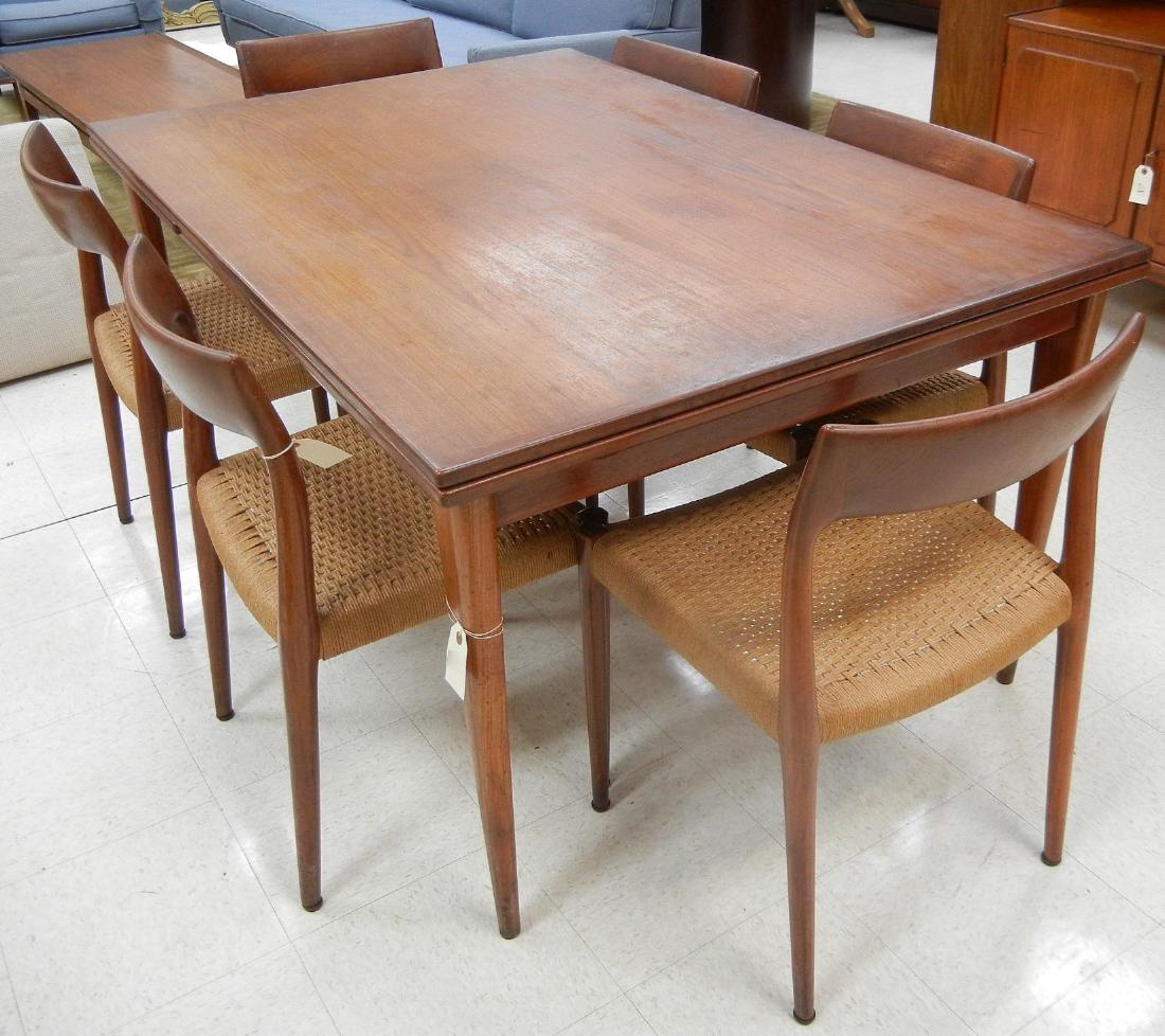 J. L. Moller Danish Teak Table & 6 Chairs.: J. L. Moller Models Danish teak draw leaf dining table and (6) chairs with woven seats. Table and chairs marked J. L. Moller Models Made in Denmark, Danish Furniture Makers Control. (Table: approx. 29