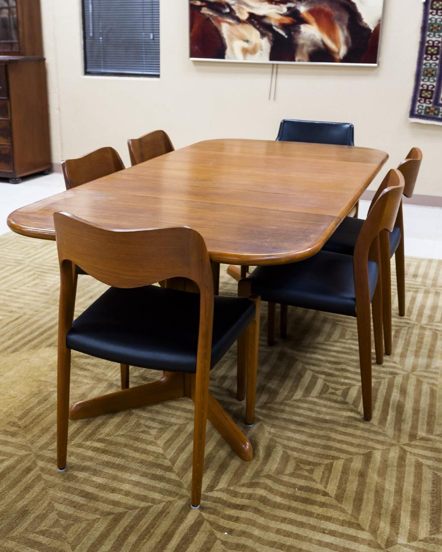 Gudme Danish Dining Table w/ 6 Associated Chairs.: Gudme Mobelfabrik Danish teak dining table with 2 leaves. With (5) vinyl seat chairs marked J. L. Moller models and a vinyl back and seat armchair marked Glostrup Made in Denmark. (Table: 39" x 38 1/2