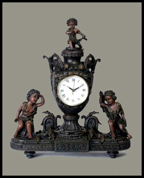 VICTORIAN CUPID URN CLOCK ANTIQUE FINISH: Size: 15.25 In. H, 14 In. W, 6 In. D, Material: Antiqued Brown Finish Resin, Quartz Movement, Battery Operated