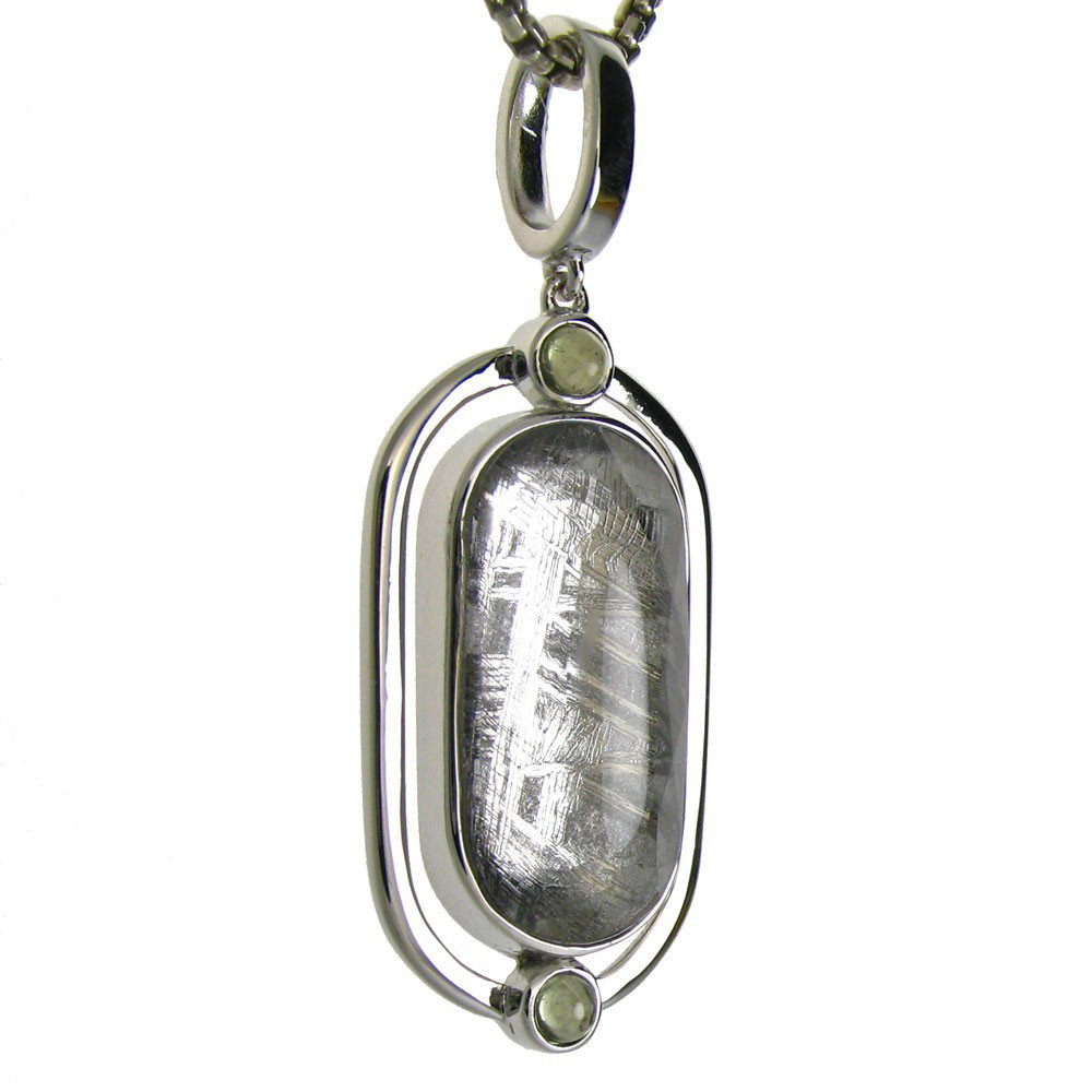 METEORITE AND MOLDOVITE PENDANT: Measures: 1.75" Tall x .75" Wide - Metal: Sterling Silver Handcrafted Frame - Stone: Gibeon Meteorite - Bohemian Moldovite - Pendant features both the famous Gibeon meteorite and moldovite gemstones.