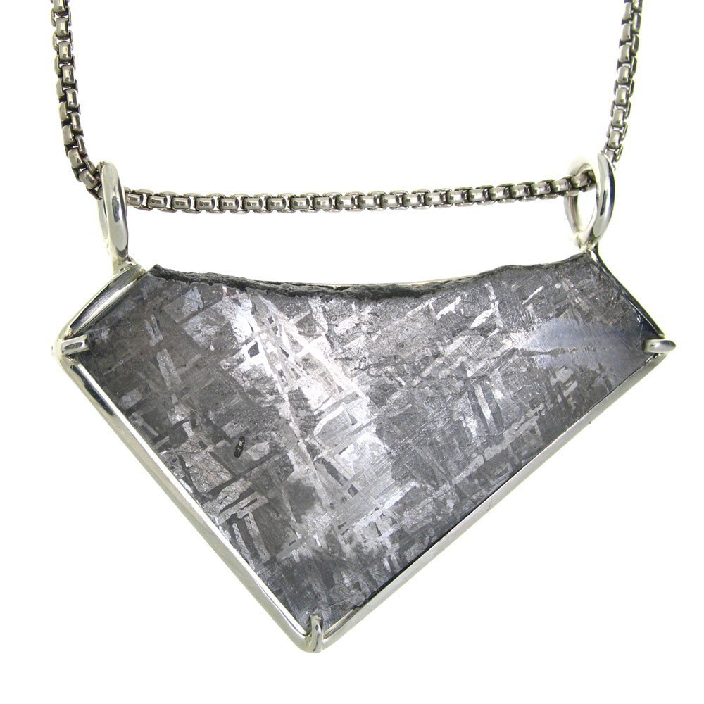 GIBEON METEORITE, NAMIBIA AFRICA: Carat Weight: 58 Carat Meteorite - Chain: Choose Necklace - Measures: 1.25" Tall x 2" Wide - Metal: Sterling Silver Necklace - First discovered in Namibia, Africa in 1836, the Gibeon meteorites come f