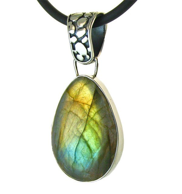 LABRADORITE FROM FINLAND: A Beautiful Diamond Cut Labradorite In A Custom Sterling Pendant. Specimen Is From Finland And It Exhibits Bold Flashes Of Blue, Violet And Green And Orange. Anyone Familiar With Labradorite Will Appr