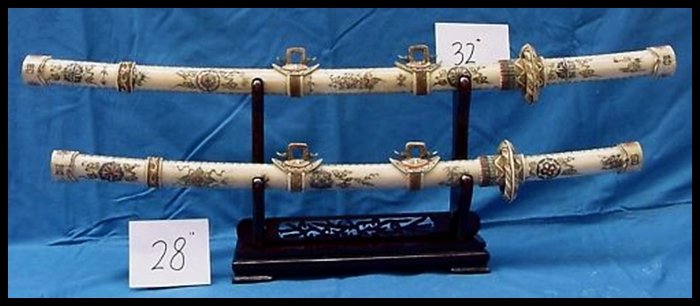 2X ANTIQUE BONE JAPANESE SWORD SET: 2X Antique Bone Japanese Sword Set - This Sword Set Is Made Of Bones. It Has Been Specially Stained And Painted. There Is A Dragon Carved In The Front. It Sits On A Rosewood Stand. The Sword Blade Is 