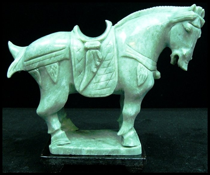 REAL JADE SADDLED TANG HORSE: Real Jade Saddled Tang Horse - This Horse Is Made From One Piece Solid Taiwan Jade. It Appears Light Green With Some Area Dark Green. It Comes With A Wooden Base - L: 7", W: 3", H: 6"