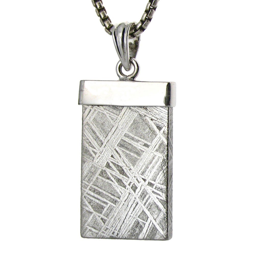 A SIMPLE GIBEON METEORITE PENDANT: A Simple Gibeon Meteorite Pendant - Metal: Sterling Silver Top - Stones: Gibeon Meteorite - Africa - Measures: 1.25" Tall X .6" Wide -