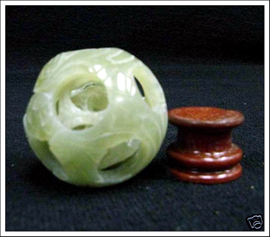 REAL JADE 3 LAYER PUZZLE BALL: Real Jade 3 Layer Puzzle Ball - This Wonderful Piece Of Work Is Made Of Real Jade. In One Piece Of Solid Jade, We Carved In A Few Layers And It Is Carved From Inside Out. The Most Interesting Part Of 