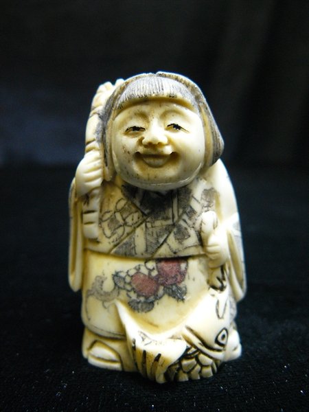 ANTIQUE BONE JAPANESE NETSUKE: Antique Bone Japanese Netsuke - Long: 1.5", Deep: 1", High: 2" - All Hand Carved From Solid Bone. Hand Painted With Signature On The Bottom. There Are 2 Holes On The Back, Which Are Used For Hanging. 