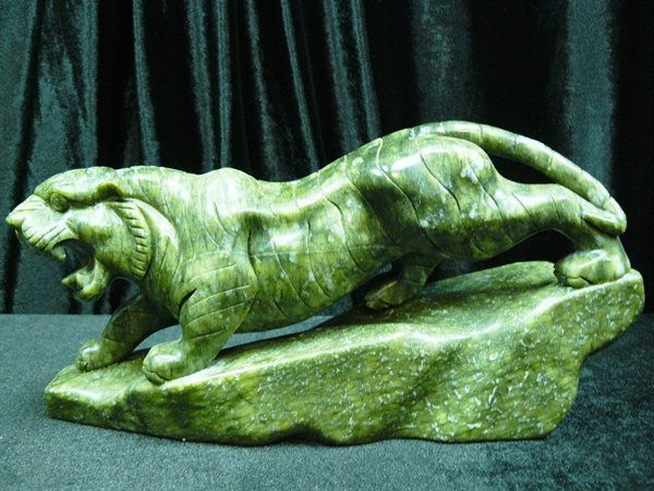 GREEN JADE RUNNING TIGER: Green Jade Running Tiger Size: Long 12", Deep 3", High: 6.5" This Jade Tiger Is Made From One Solid Piece Of Jade. It Appears Dark Gree. It Is All Hand Carved. Very Detailed.