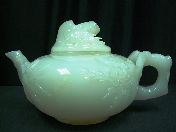PURE WHITE JADE FLOWER TEAPOT: Pure White Jade Flower Teapot Size: Wide 12", Deep 8", High 7" This Beautiful Teapot Is Made From Natural Han White Jade. There Are Flowers, Bamboo, Cherry Etc Carved On The Surface Of The Body, As We