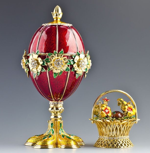 FLOWERS BASKET FABERGE STYLE EGG: 6'' (H) X 3'' (W) 2 lbs 1 oz Pewter, Enamel, Crystals Boxed. The Spring Flowers Faberge egg is in strawberry red enamel with guilloche ground with golden flowers and green leaves ornamented with tiny 