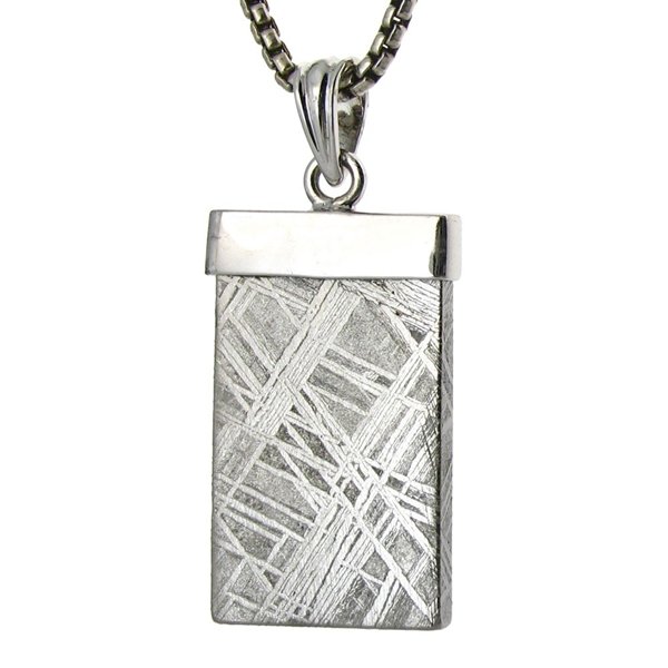 A SIMPLE GIBEON METEORITE PENDANT: A Simple Gibeon Meteorite Pendant- - -Metal: Sterling Silver Top-Stones: Gibeon Meteorite - Africa-Sizes-Measures: 1.25" Tall X .6" Wide