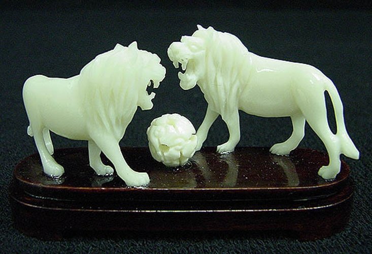 SOLID BONE 2 LIONS: Solid Bone 2 Lions Long: 3", Wide: 1", High: 2" This Beautiful Art Is Made From High Quality Solid Bones. All Natural And All Hand Carved. It Is Not Bone Powder, Resin Or Mouded. Very Detailed Carving