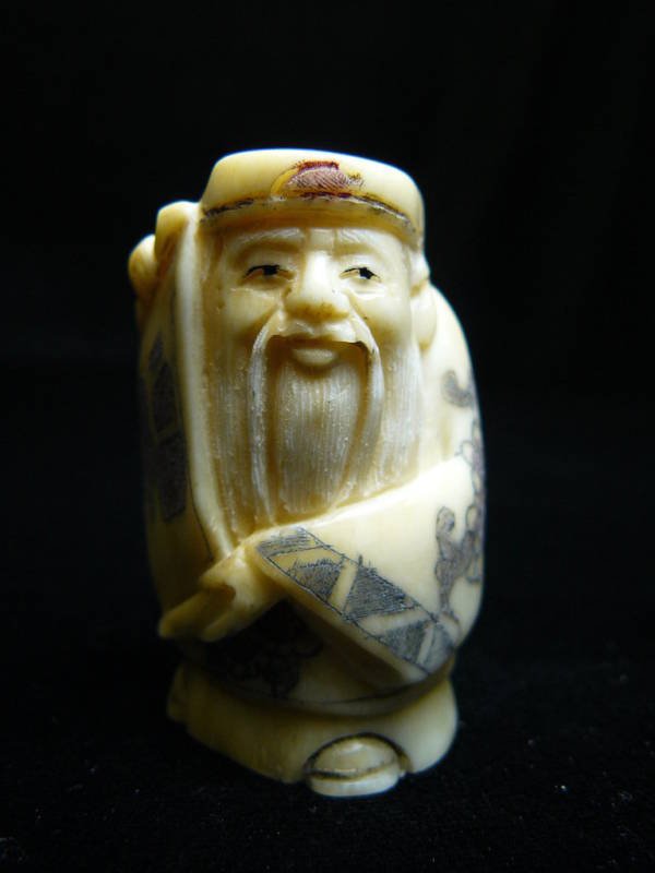ANTIQUE BONE NETSUKE: Antique Bone Netsuke - Long: 1.5", Deep: 1", High: 2" - This Is A Very Beautifully Carved Netsuke. All Hand Carved From One Solid Piece Of Solid Bone. Hand Painted With Signature On The Bottom. There 