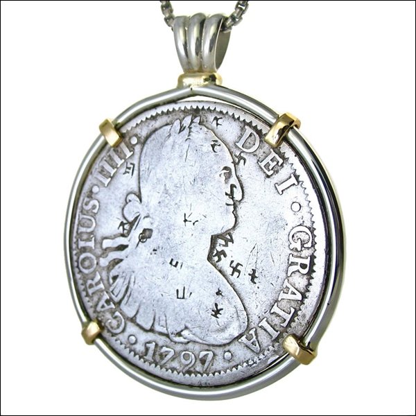 A PIECE OF EIGHT WITH A SACRED FORCE CHOPMARK: A Piece Of Eight With A Sacred Force Chopmark---metal: Frame Is 14kt Gold And Sterling-measures: 1.70" Diameter--