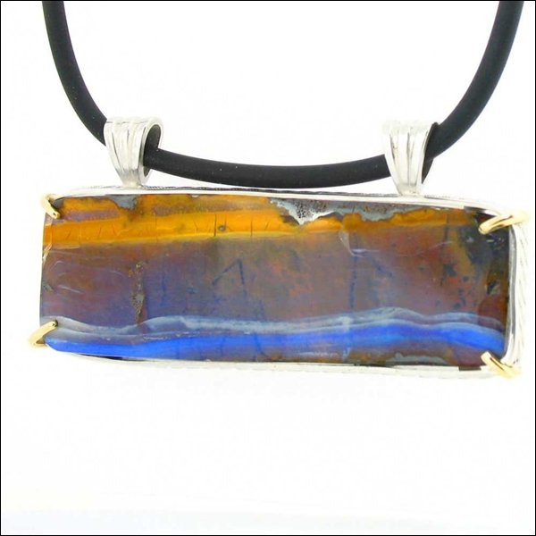 115 CARAT BOULDER OPAL: 115 Carat Boulder Opal---metal: Sterling Silver Handcrafted Frame-stones: Australian Boulder Opal - 115 Carats-measures: 2.6" Wide X 1" Tall-