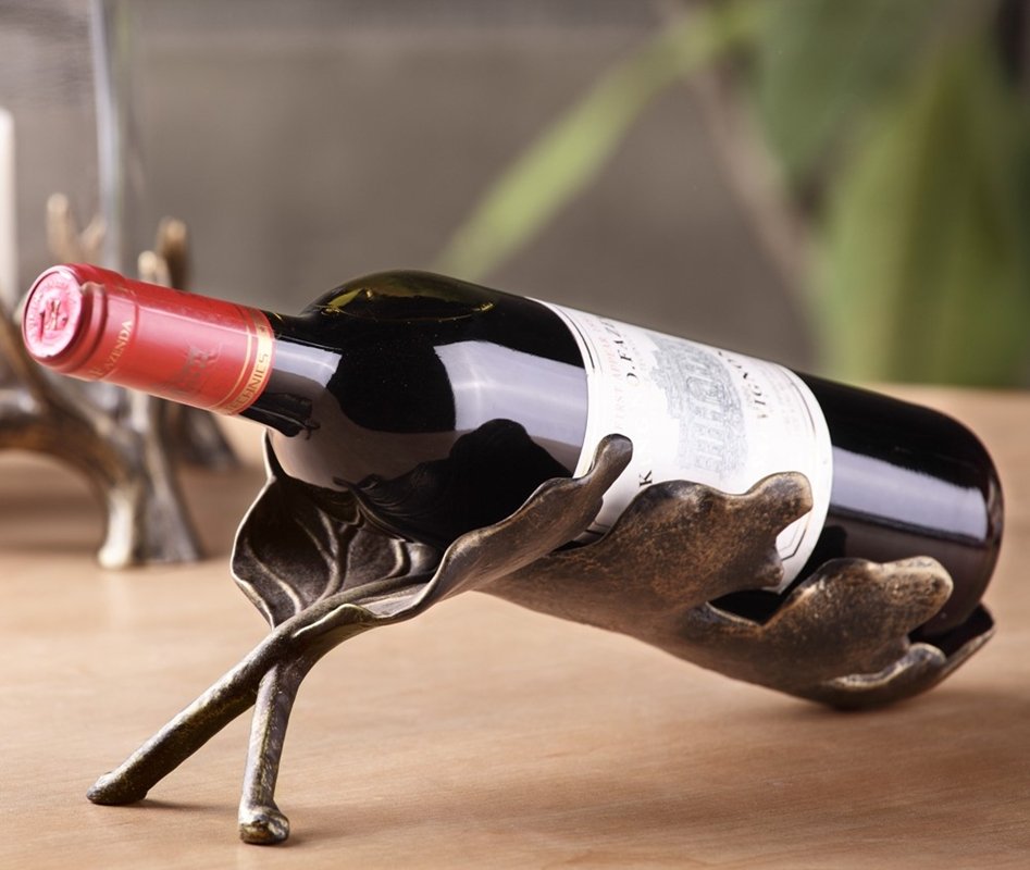 BANANA LEAF WINE BOTTLE HOLDER: Banana Leaf Wine Bottle Holder - Weight: 0.7 Lbs - Size: 4"H 11.5"W 5"D - Material: ALUMINUM