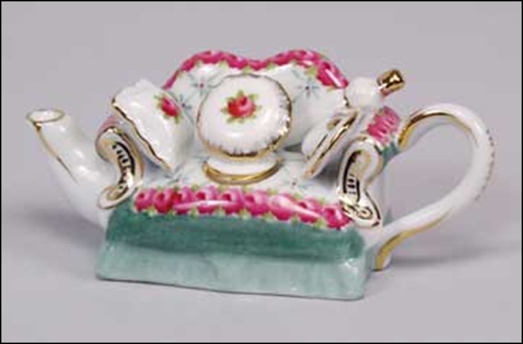 MINI SOFA TEA POT - DIMENSIONS: 1.75H 4.50W 1.50D: MINI SOFA TEA POT - DIMENSIONS: 1.75H 4.50W 1.50D
