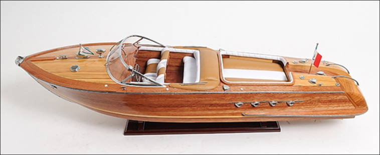 RIVA AQUARAMA EXCLUSIVE EDITION: Riva Aquarama Exclusive Edition - Length: 35" x Width: 9" x Height: 10" - The Riva Aquarama was designed by Carlo Riva in the 1960s. The Riva is noted as one of the most legendary and famous speedboat