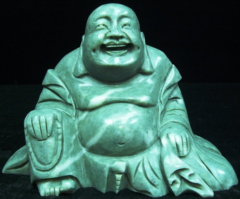 JADE SITTING BUDDHA: Jade Sitting Buddha - Wide: 7", Deep: 3", High: 5". - This Buddha Is Made From One Solid Piece Of Southern Jade. Light Green With Some Spots Dark Green. Very Detailed Carving.