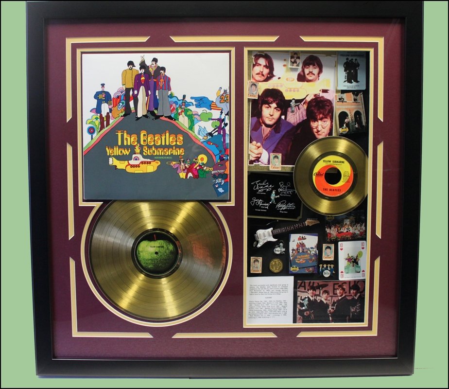 Beatles Yellow Submarine - LP / 45 Collage - One Of A: Beatles Memorabilia Collage - Golden Records - Each Collage Will Vary As They Are One-Of-A-Kind - Framed & Matted. Dimensions: 30x31