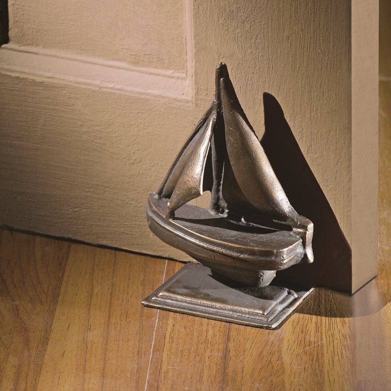 SAILBOAT DOORSTOP: Sailboat Doorstop - Weight: 1.5 Lbs - Size: 6"H 4.5"W 3.5"D - Material: CAST IRON