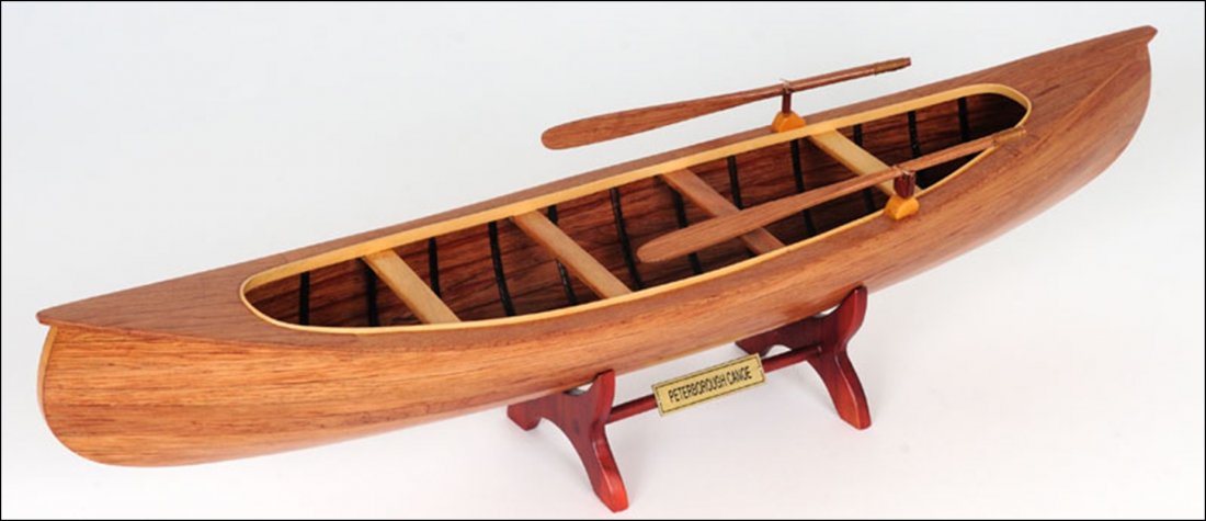 PETERBOROUGH CANOE: Peterborough canoe - Length: 23.5" x Width: 4.75" x Height: 6" - This is a FULLY ASSEMBLED replica of a Peterborough Canoe. It looks and feels like a miniature real boat. This 23.5-inch model is strip
