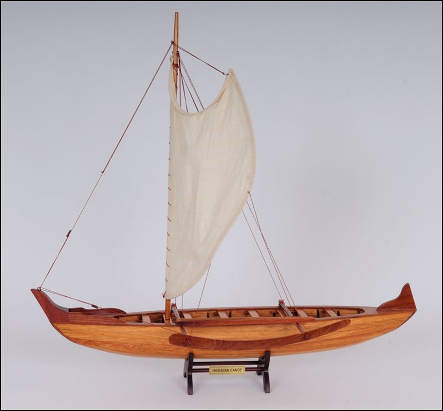 HAWAIIAN CANOE: Hawaiian Canoe - Length: 25.25" x Width: 10" x Height: 24" - In the early 1900's outrigger canoe racing became a popular sport in Hawaii. Have this beautiful Hawaiian canoe model display in your own h