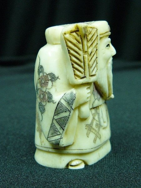 2" BONE NETSUKE: 2" Bone Netsuke - 1"x1.5"x2" - this is a very beautifully carved netsuke. All Hand Carved From One Solid Piece Of solid bone. Hand Painted With Signature On The Bottom. There Are 2 Holes On The Back, 