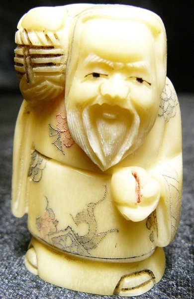 2" BONE NETSUKE: 2" Bone Netsuke - 1"x1.5"x2" - this is a very beautifully carved netsuke. All Hand Carved From One Solid Piece Of solid bone. Hand Painted With Signature On The Bottom. There Are 2 Holes On The Back, 