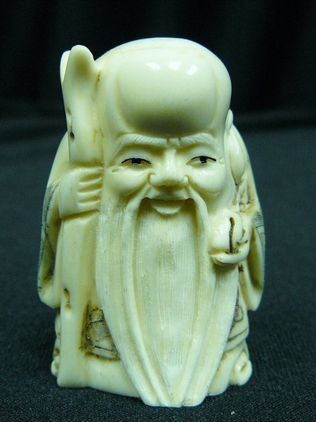 2" BONE NETSUKE: 2" Bone Netsuke - 1"x1.5"x2" - this is a very beautifully carved netsuke. All Hand Carved From One Solid Piece Of solid bone. Hand Painted With Signature On The Bottom. There Are 2 Holes On The Back, 