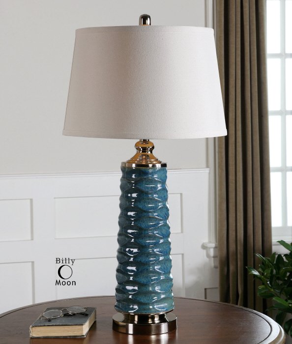 DELAVAN RUST BLUE TABLE LAMP: Delavan Rust Blue Table Lamp - Scalloped Ceramic Finished In A Rust Blue Glaze Accented With Polished Chrome Details. The Round, Slightly Tapered Hardback Shade Is A White Linen Fabric. - Material: Ce