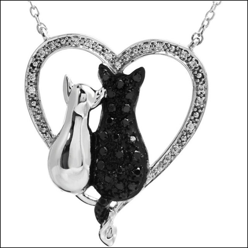 TENDER VOICES CATS HEART NECKLACE: TENDER VOICES CATS HEART NECKLACE - Sterling Silver / Necklace / Complete With Stone / Round / Various / Black & White Diamond / Polished / 1/5Ctw Bl&Wh Dia Double Cat Nc - Weight: 1.01DWT - GramWeigh