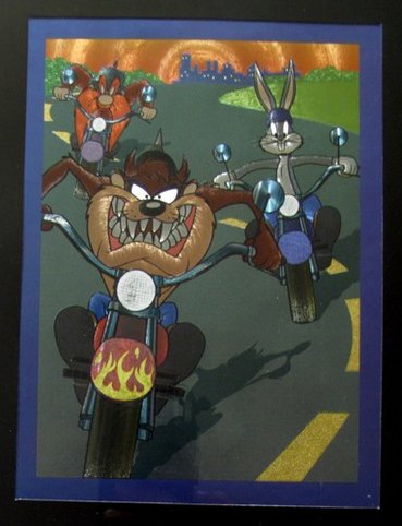 LOONEY TUNES TAZ YOSEMITE SAM BUGS BUNNY MOTORCYCLE: This Is A Warner Bros Looney Tunes Framed Foil Art. This Fantastic Animation Features Yosemite Sam, Taz, & Bugs Bunny Riding Motorcycles As They Appeared In The 1970's Cartoons. This Beautifully Frame