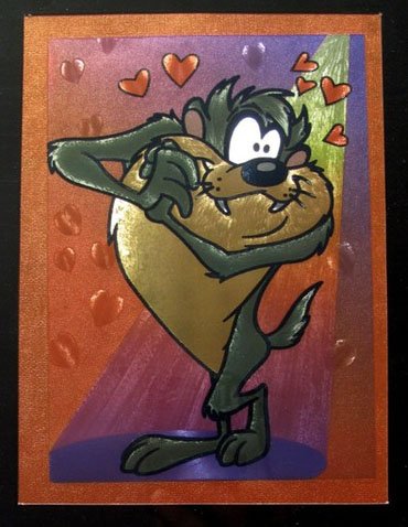 LOONEY TUNES TAZ IN LOVE FRAMED FOIL ART: This Is A Warner Bros Looney Tunes Framed Foil Art. This Fantastic Animation Features Taz The Tasmanian Devil In Love As He Appeared In The 1970's Cartoons. This Beautifully Framed And Matted Art Piec