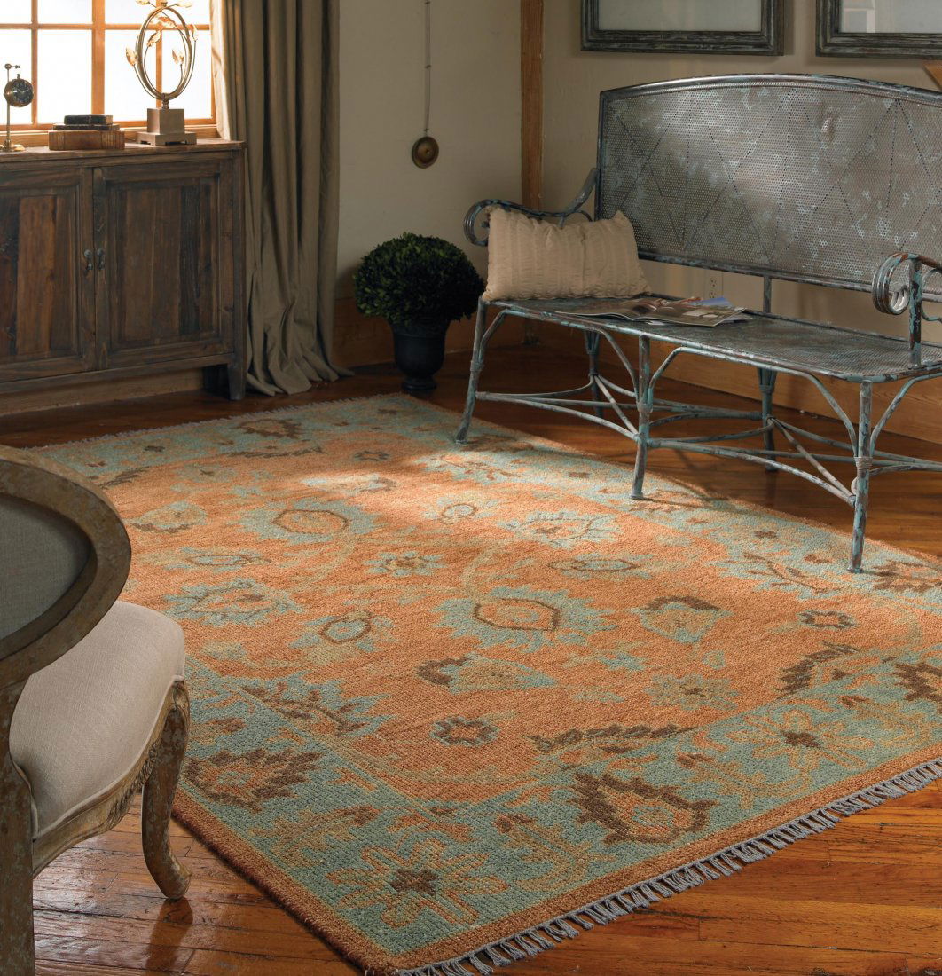 AKBAR 6 X 9 HAND TUFTED RUG: AKBAR 6 X 9 HAND TUFTED RUG - RUST, EGYPTIAN BLUE, AND TAUPE - HAND KNOTTED WOOL IN HEAVILY DYED WEATHERED RUST WITH EGYPTIAN BLUE DETAILS AND TAUPE ACCENTS. MATERIAL: WOOL OVERALL DEPTH IN INCHES: 0.